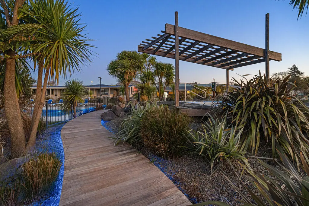 Thermal pool at dusk at Tasman Holiday Parks Rotorua